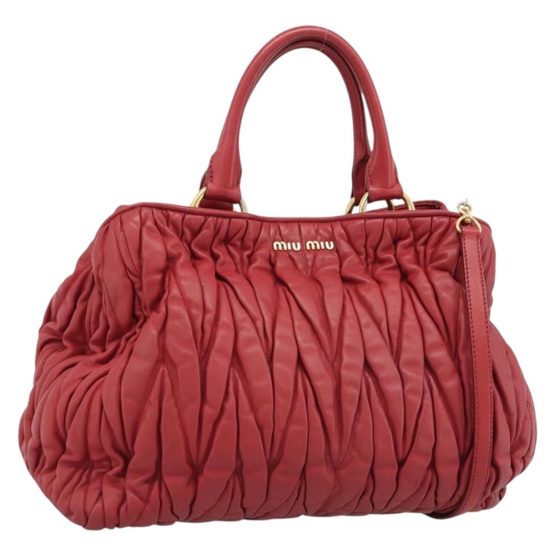 Miu Miu Matelasse Leather 2way Handbag Red with Strap Dust Bag: Miu Miu Matelasse Leather 2way Handbag Red with Strap Dust Bag Miu Miu Matelasse leather 2way handbag in red with gold-tone hardware. It comes with a dust bag and shoulder strap, and was made in Turke