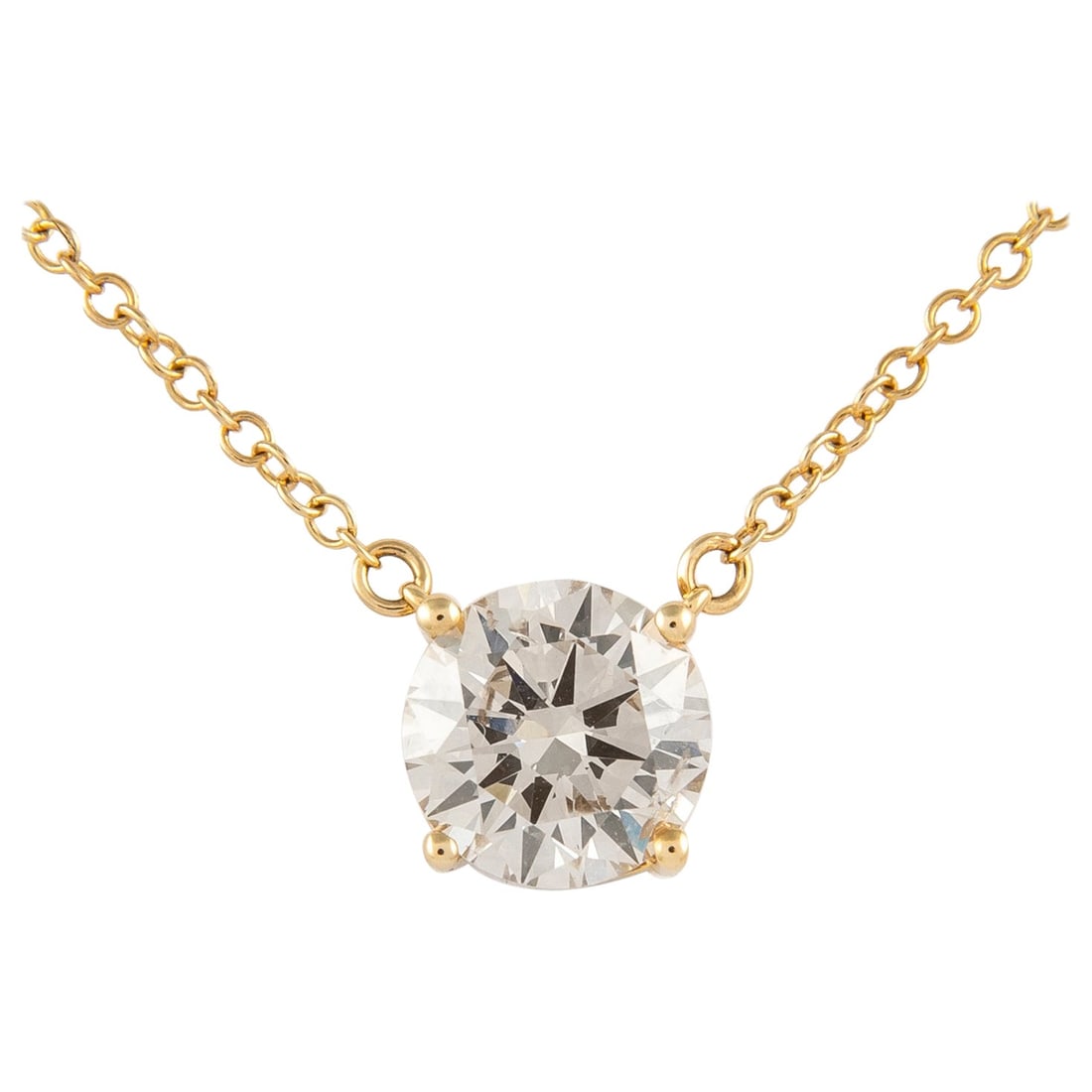 1.51ct Diamond Solitaire Pendant Necklace in 14k Yellow Gold: 1.51ct Diamond Solitaire Pendant Necklace in 14k Yellow Gold This exquisite diamond solitaire pendant necklace features a stunning 1.51 carat round brilliant cut diamond, showcasing approximately J co