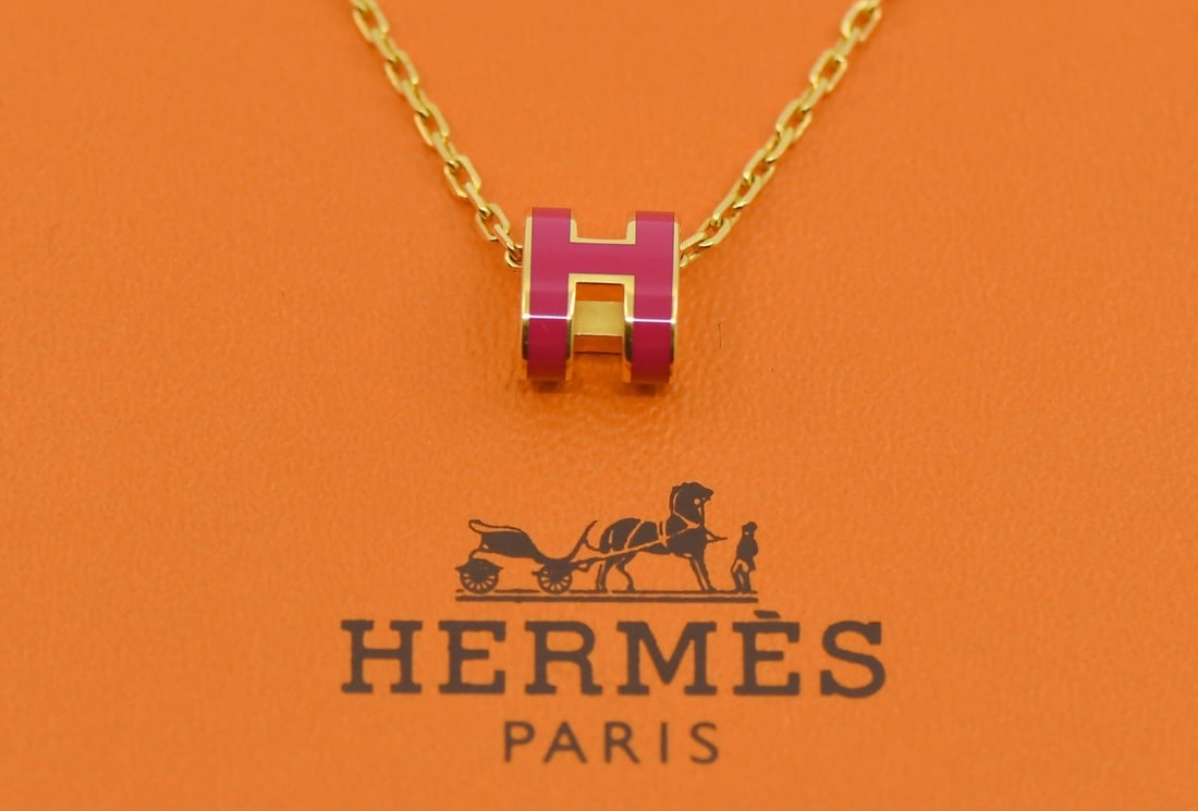 Hermes Mini Pop Charm Necklace Gold Plated 16 Inches: Hermes Mini Pop Charm Necklace Gold Plated 16 Inches This Hermes Mini Pop necklace features a gold plated charm design and comes with its original box. Made in France, this pre-owned piece showcases t