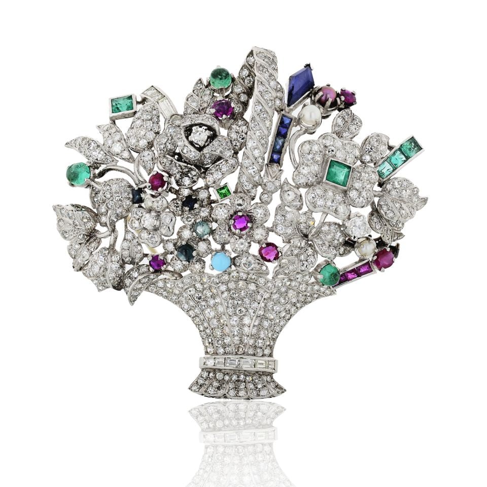 1950's Platinum Brooch with 4cts Diamonds and Multicolor Gemstones: 1950's Platinum Brooch with 4cts Diamonds and Multicolor Gemstones This exquisite 1950's brooch showcases a stunning array of multicolor gemstones alongside sparkling diamonds, all beautifully crafted