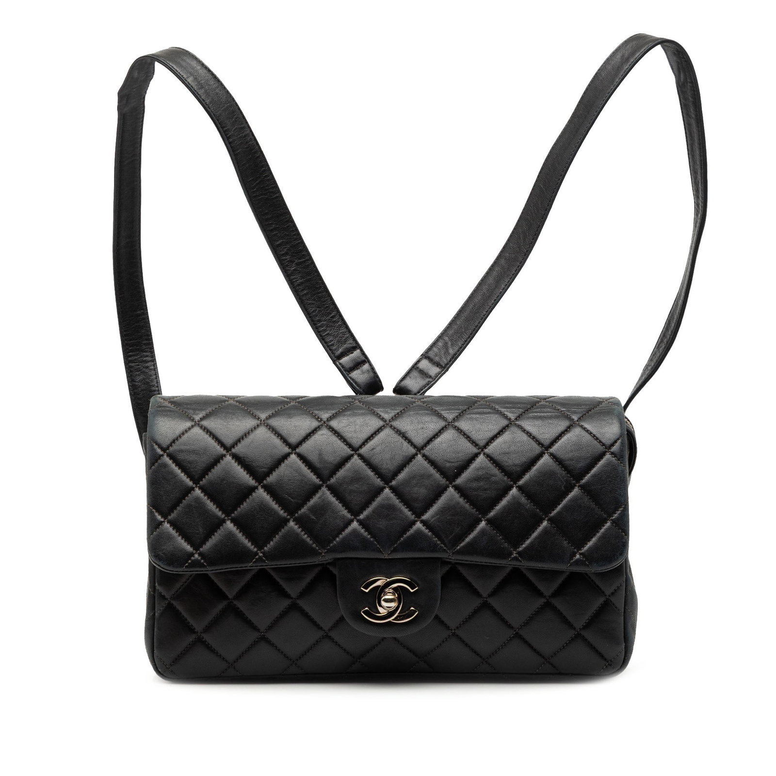 Chanel Black Lambskin Quilted Flap Medium Backpack with CC Turn Lock: Chanel Black Lambskin Quilted Flap Medium Backpack with CC Turn Lock This Chanel medium backpack features a quilted black lambskin leather body with a front flap secured by a CC turn lock closure. It 