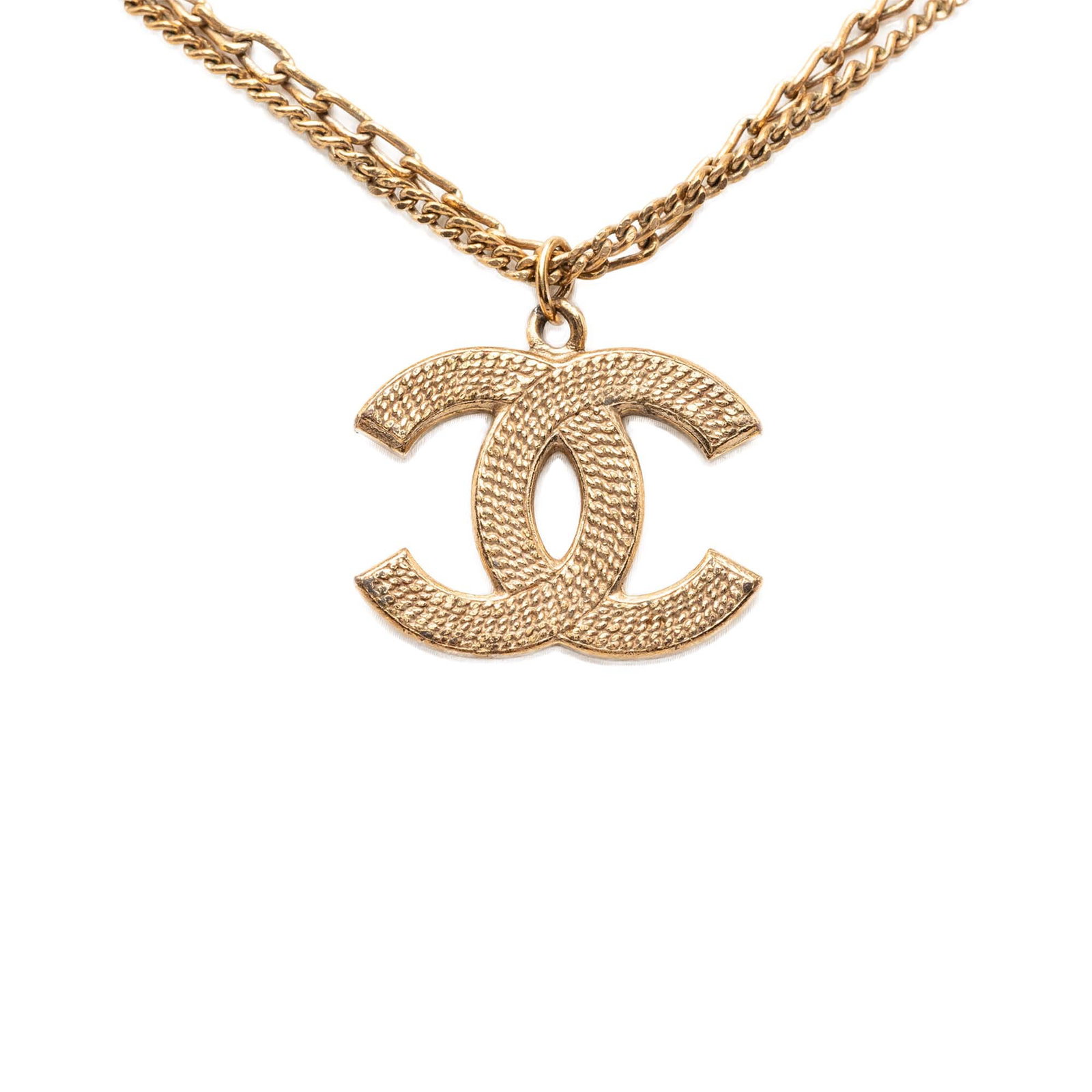 Chanel CC Pendant Gold Tone Double Chain Necklace: Chanel CC Pendant Gold Tone Double Chain Necklace This Chanel necklace features a gold-tone metal body with a textured pendant and a double chain design. It is secured with a lobster clasp closure. Th