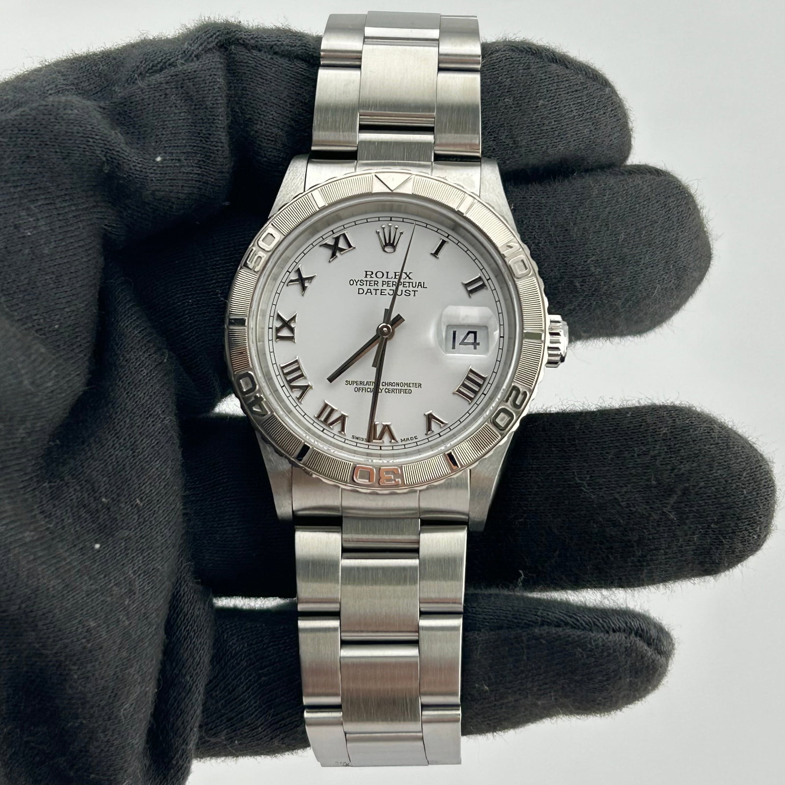 Rolex 16264 Oyster Perpetual DateJust watch white Roman dial papers: Rolex 16264 Oyster Perpetual DateJust watch white Roman dial papers Rolex Oyster Perpetual DateJust watch with a white dial featuring Roman numerals, an engine turned bezel, and an Oyster bracelet. Th