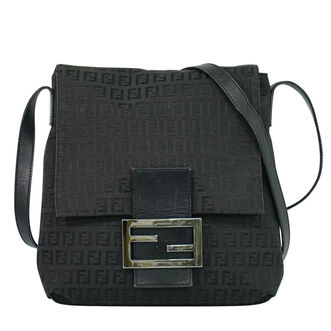 Fendi Vintage Flap Crossbody Bag in Black Zucchino Canvas: Fendi Vintage Flap Crossbody Bag in Black Zucchino Canvas This Fendi vintage flap crossbody bag features the iconic Zucchino canvas in black. Designed for women, it showcases a classic flap closure an