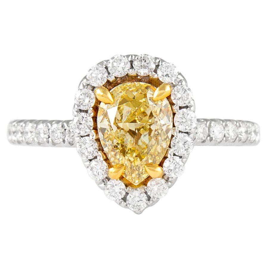 1.78ct Fancy Yellow Diamond Halo Ring 18k Gold EGL Certified: 1.78ct Fancy Yellow Diamond Halo Ring 18k Gold EGL Certified This exquisite 1.78ctt Fancy Yellow Pear Diamond with Halo Ring is crafted from luxurious 18k gold, featuring a stunning two-tone design in