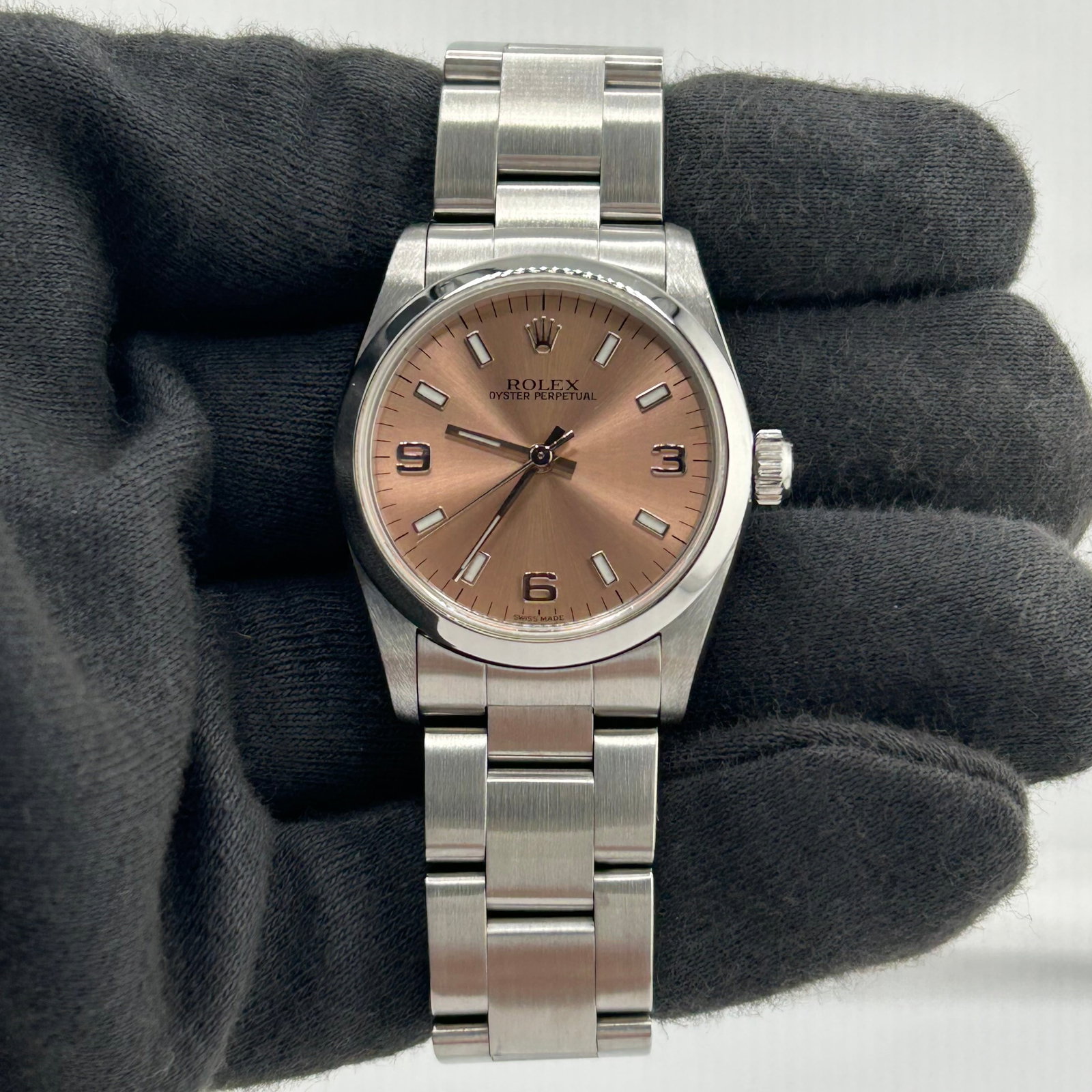 Ladies Rolex Oyster Perpetual Ref 67480 Salmon Dial Watch: Ladies Rolex Oyster Perpetual Ref 67480 Salmon Dial Watch Ladies Rolex Oyster Perpetual watch, reference 67480, featuring a salmon dial, smooth bezel, and Oyster bracelet. The serial number is T63XXXX