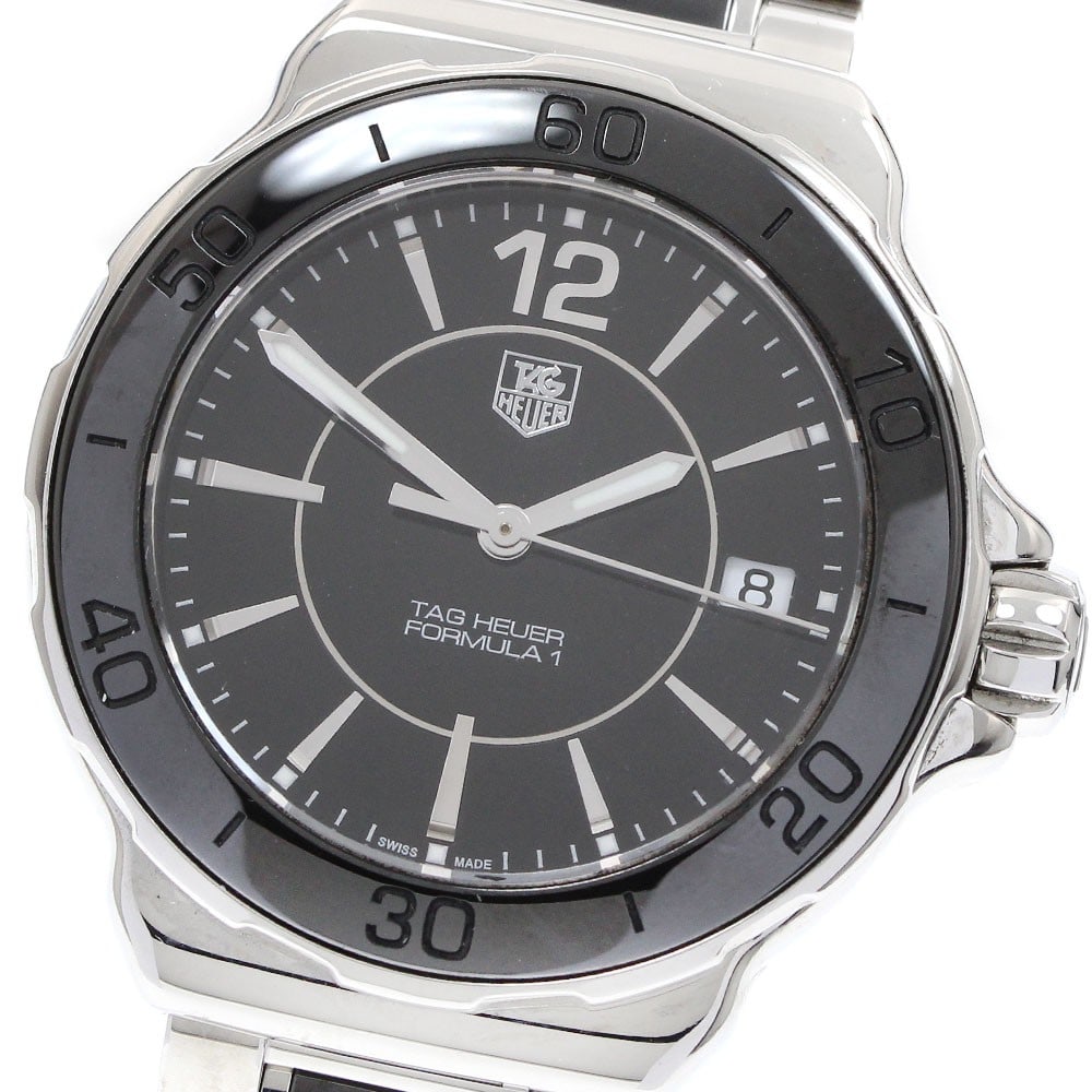 TAG Heuer Formula 1 WAH1210 Quartz Date Women Watch: TAG Heuer Formula 1 WAH1210 Quartz Date Women Watch This TAG Heuer Formula 1 women's wristwatch features a Swiss-made quartz movement and a stylish black dial. The case and bracelet are crafted from a