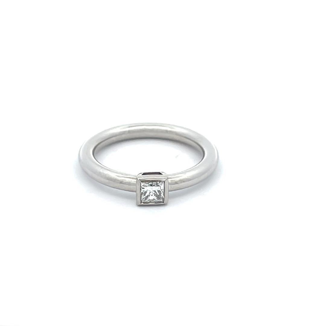 Tiffany & Co. Platinum Princess Cut Diamond Solitaire Engagement Ring: Tiffany & Co. Platinum Princess Cut Diamond Solitaire Engagement Ring This stunning engagement ring from Tiffany & Co. showcases an elegant design crafted from high-quality platinum, featuring a polis