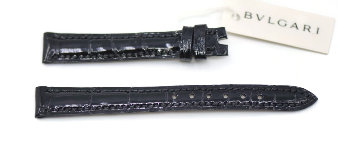 Bulgari Black Leather Wristwatch Band 12mm Strap: Bulgari Black Leather Wristwatch Band 12mm Strap This pre-owned Bulgari wristwatch band features a sleek black leather design, perfect for adding a touch of elegance to your timepiece. With a band wid
