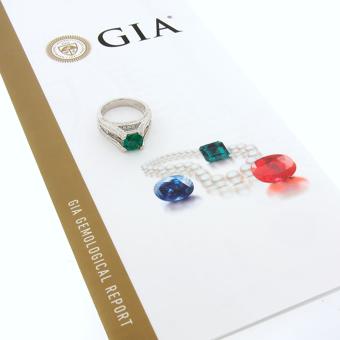 GIA Certified 18K White Gold Emerald Cocktail Ring Cushion Cut Diamond Accent: GIA Certified 18K White Gold Emerald Cocktail Ring Cushion Cut Diamond Accent This elegant cocktail ring is crafted from solid 18K white gold and features a GIA-certified, cushion cut natural emerald 