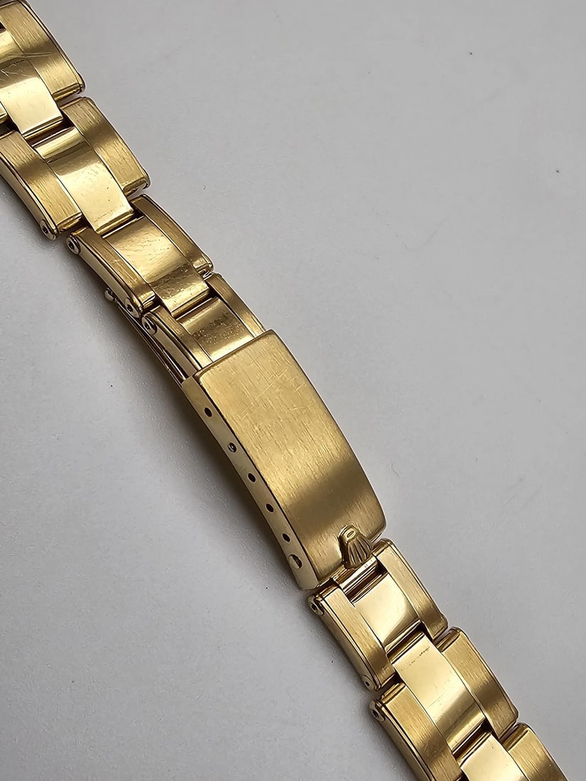 Rolex Lady Watch Bracelet 18K Yellow Gold Oyster 12mm Band: Rolex Lady Watch Bracelet 18K Yellow Gold Oyster 12mm Band This is a pre-owned Rolex Oyster wristwatch band crafted from 18K yellow gold. Designed for ladies' watches, the bracelet features a 12mm wid