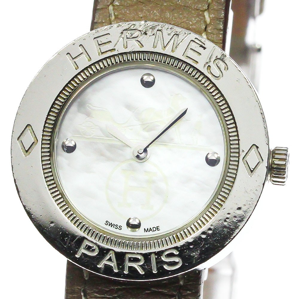 Hermes Pass-Pass PP1.210 womens quartz wristwatch steel leather: Hermes Pass-Pass PP1.210 womens quartz wristwatch steel leather This is a pre-owned HERMES Pass-Pass PP1.210 women's wristwatch featuring a stainless steel case and a leather band. The watch is powere