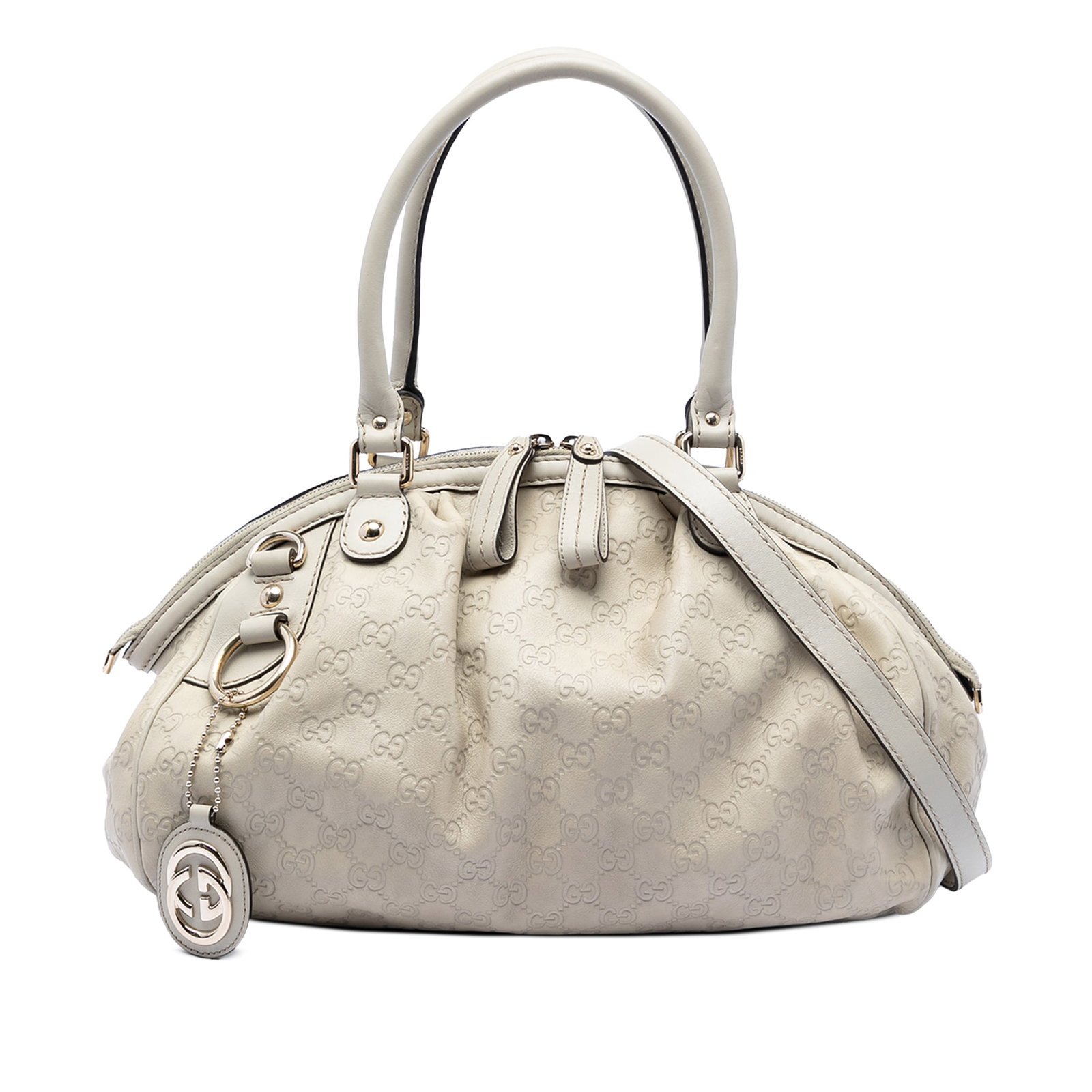Gucci White Guccissima Sukey Leather Satchel: Gucci White Guccissima Sukey Leather Satchel The Sukey Satchel features an embossed leather body with rolled leather handles and a detachable flat leather strap. It is designed with a top zip closure 