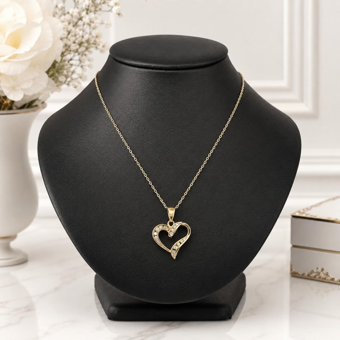 14k Chain with 10k Yellow Gold Diamond Swirl Heart Pendant 0.22ctw: 14k Chain with 10k Yellow Gold Diamond Swirl Heart Pendant 0.22ctw Open swirl heart pendant necklace in yellow gold, accented with 13 natural round brilliant cut diamonds in a channel-set design. This