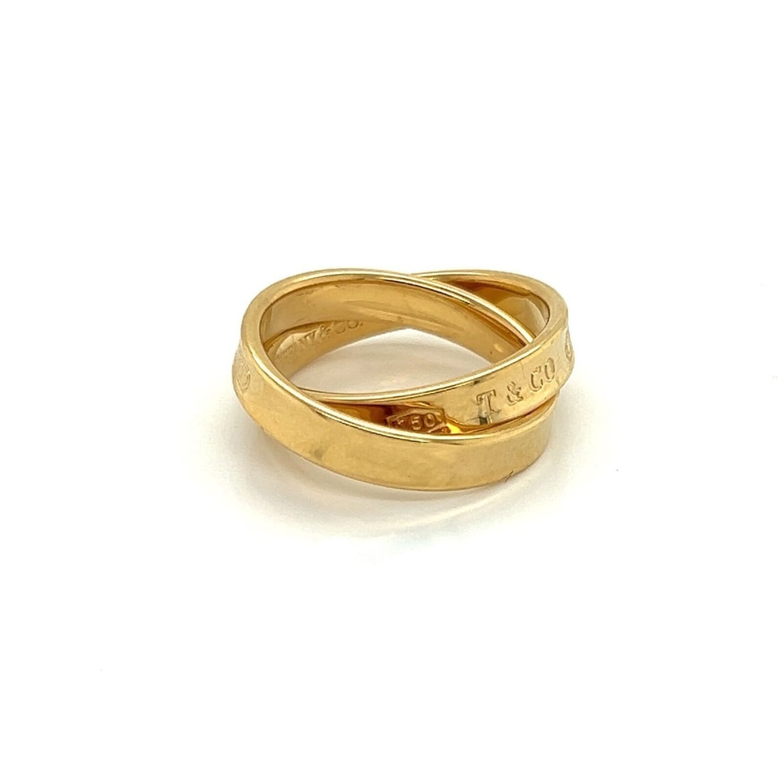 Tiffany & Co. 1837 Interlaced Band Ring in 18k Yellow Gold 4.5: Tiffany & Co. 1837 Interlaced Band Ring in 18k Yellow Gold 4.5 A Tiffany & Co. 1837 Interlaced band ring crafted in 18k yellow gold. The ring features an interlaced polished band design and is signed,