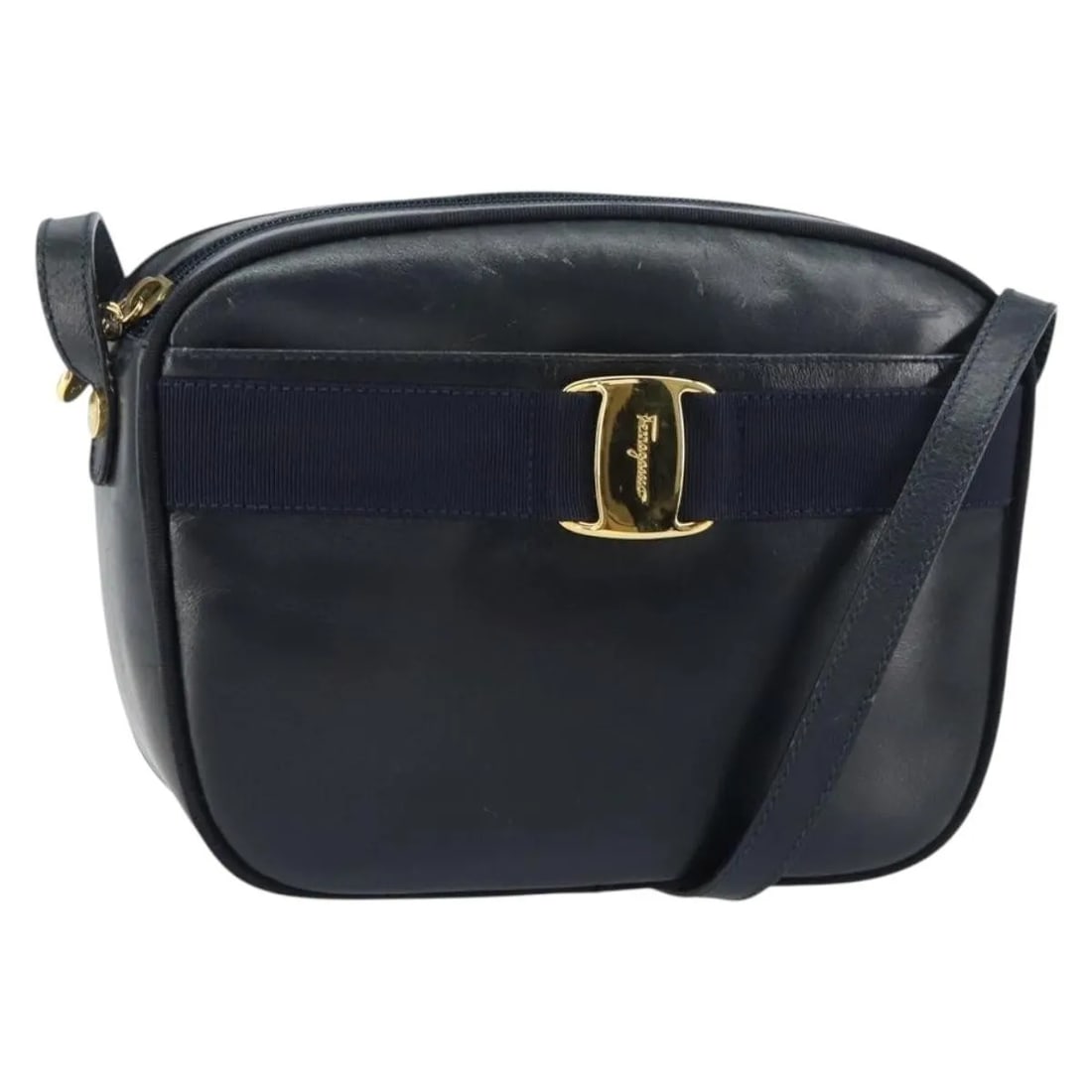 Navy Leather Shoulder Bag Salvatore Ferragamo Vala Italy: Navy Leather Shoulder Bag Salvatore Ferragamo Vala Italy This Salvatore Ferragamo Vala shoulder bag is crafted from navy leather and designed for women. Made in Italy, it features a classic silhouette