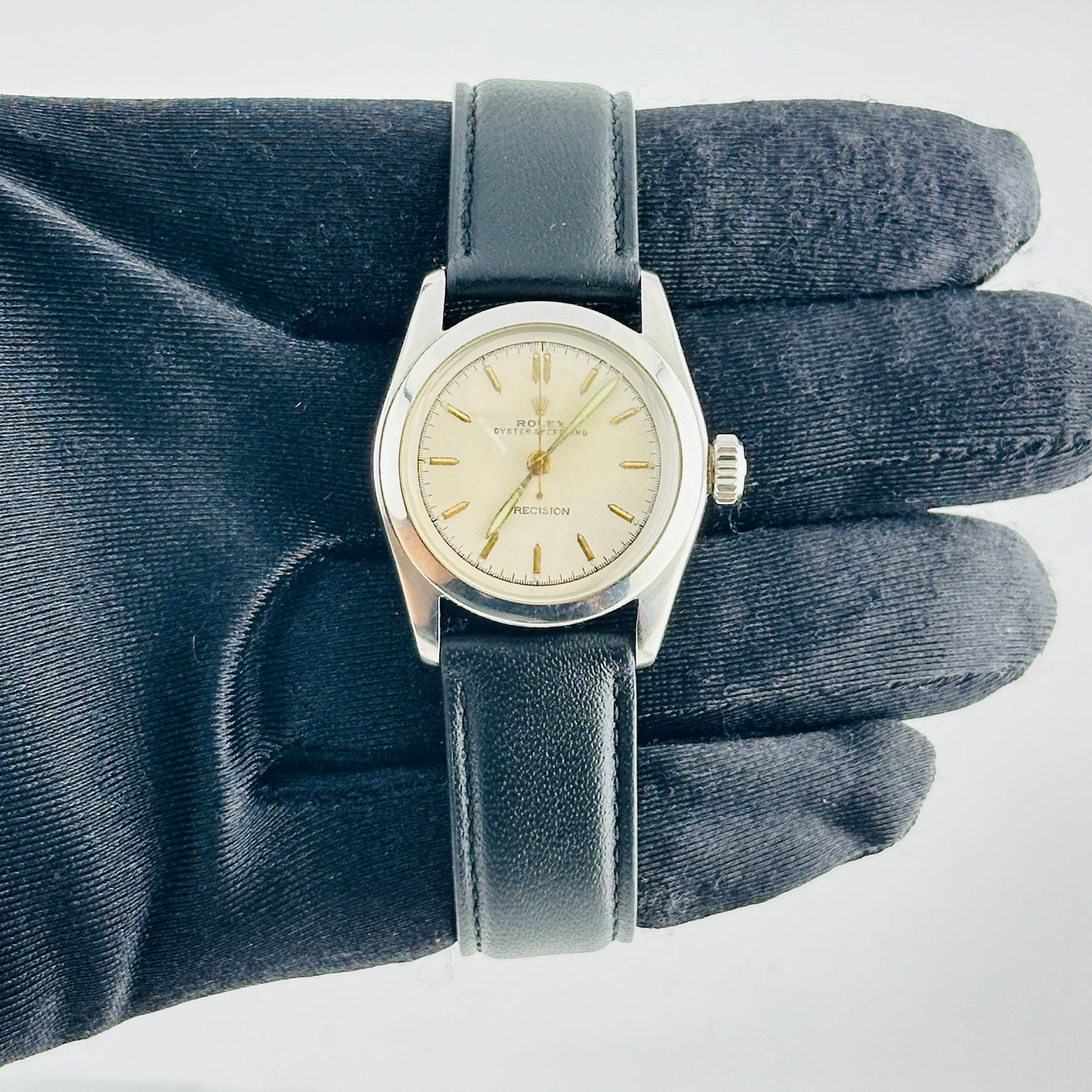 Rolex Oyster Speed-King Ladies Watch Ref. 6056 Silver Dial Leather Band: Rolex Oyster Speed-King Ladies Watch Ref. 6056 Silver Dial Leather Band Rolex Oyster Speed-King wristwatch featuring a silver dial with gold stick markers, a smooth bezel, and a generic leather band. 