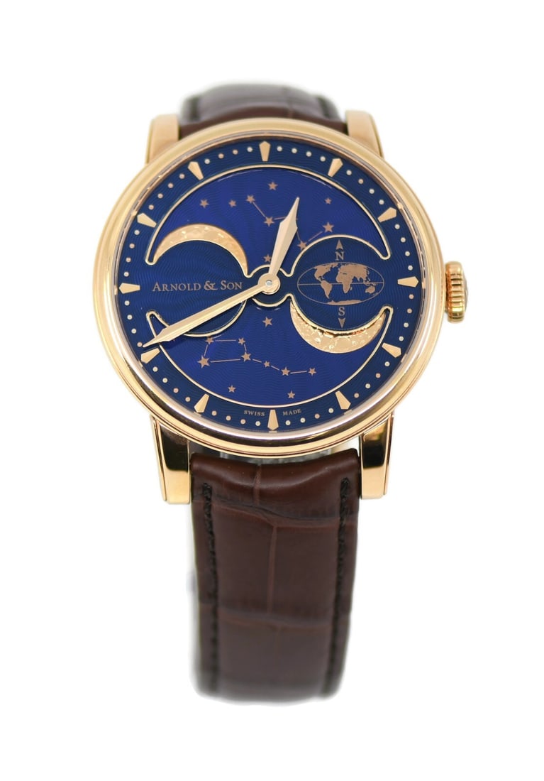 Arnold & Son Double Perpetual 18K Rose Gold Watch 41mm with Papers: Arnold & Son Double Perpetual 18K Rose Gold Watch 41mm with Papers The Arnold & Son Double Perpetual is a luxurious wristwatch crafted in 18K rose gold, featuring a stunning blue dial and analog displ