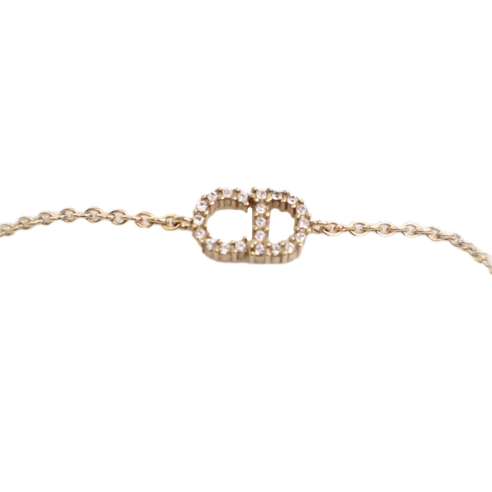 Dior Petit CD Gold Plated Rhinestone Chain Bracelet: Dior Petit CD Gold Plated Rhinestone Chain Bracelet This Dior Petit CD bracelet showcases a gold plated metal chain adorned with rhinestones and secures with a lobster claw clasp. The bracelet is craf