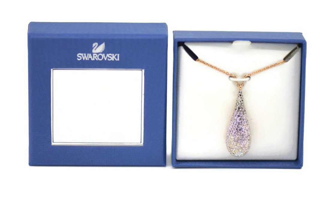 Swarovski Abstract Crystal Necklace 5144288 23.5 Inch Pendant: Swarovski Abstract Crystal Necklace 5144288 23.5 Inch Pendant Elevate your style with the Swarovski Abstract Crystal Necklace, a stunning chain pendant that showcases the brand's signature elegance. T