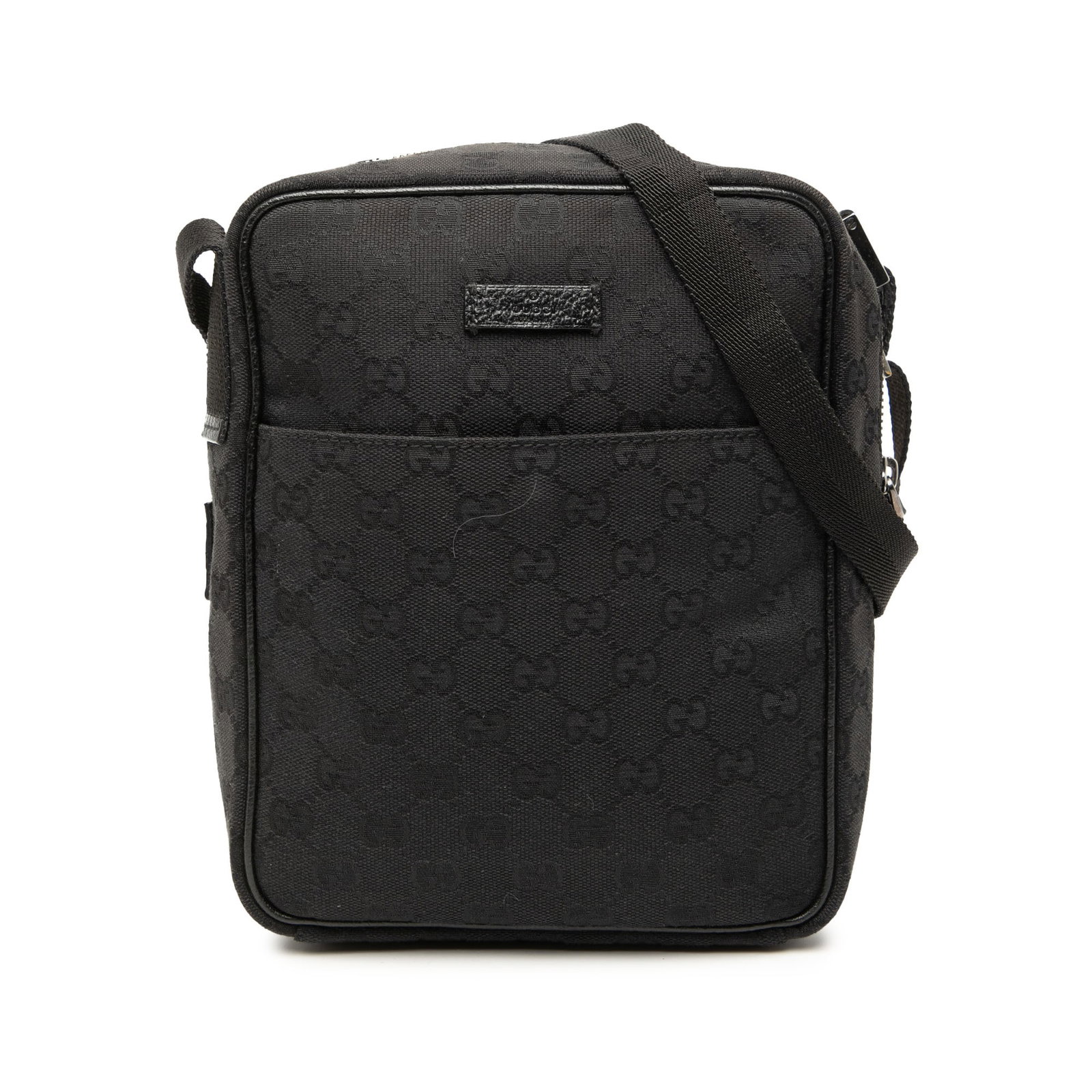 Gucci GG Canvas Black Crossbody Bag with Leather Trim: Gucci GG Canvas Black Crossbody Bag with Leather Trim This Gucci GG Canvas Crossbody bag features a canvas exterior with leather trim, a flat strap, a top zip closure, a front slip pocket, and interio