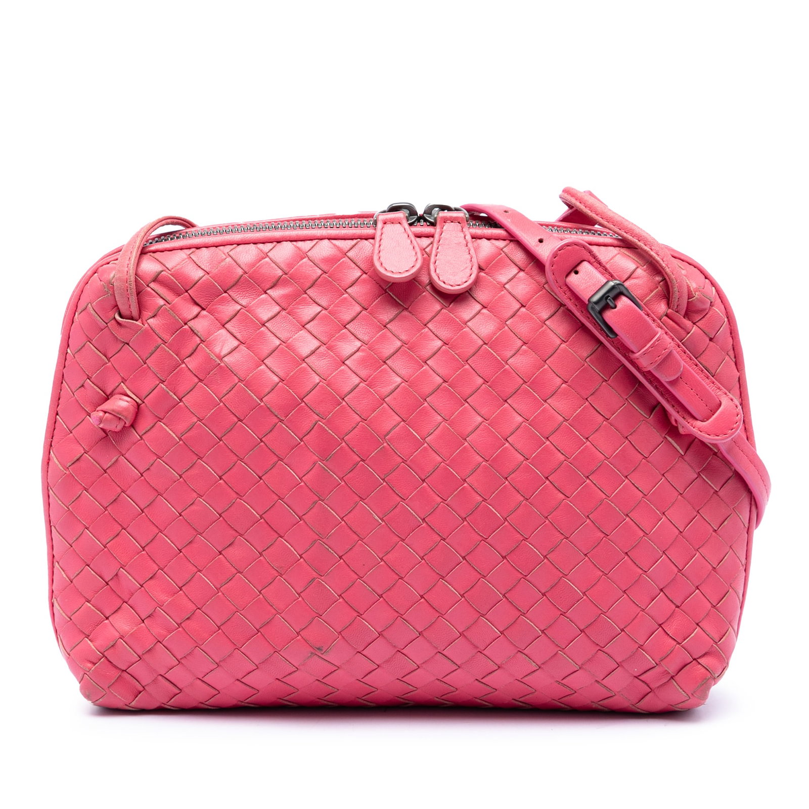 Pink Intrecciato Leather Nodini Crossbody by Bottega Veneta: Pink Intrecciato Leather Nodini Crossbody by Bottega Veneta This Bottega Veneta Nappa Intrecciato Nodini crossbody bag features the brand's signature woven leather design in pink. It is equipped with 