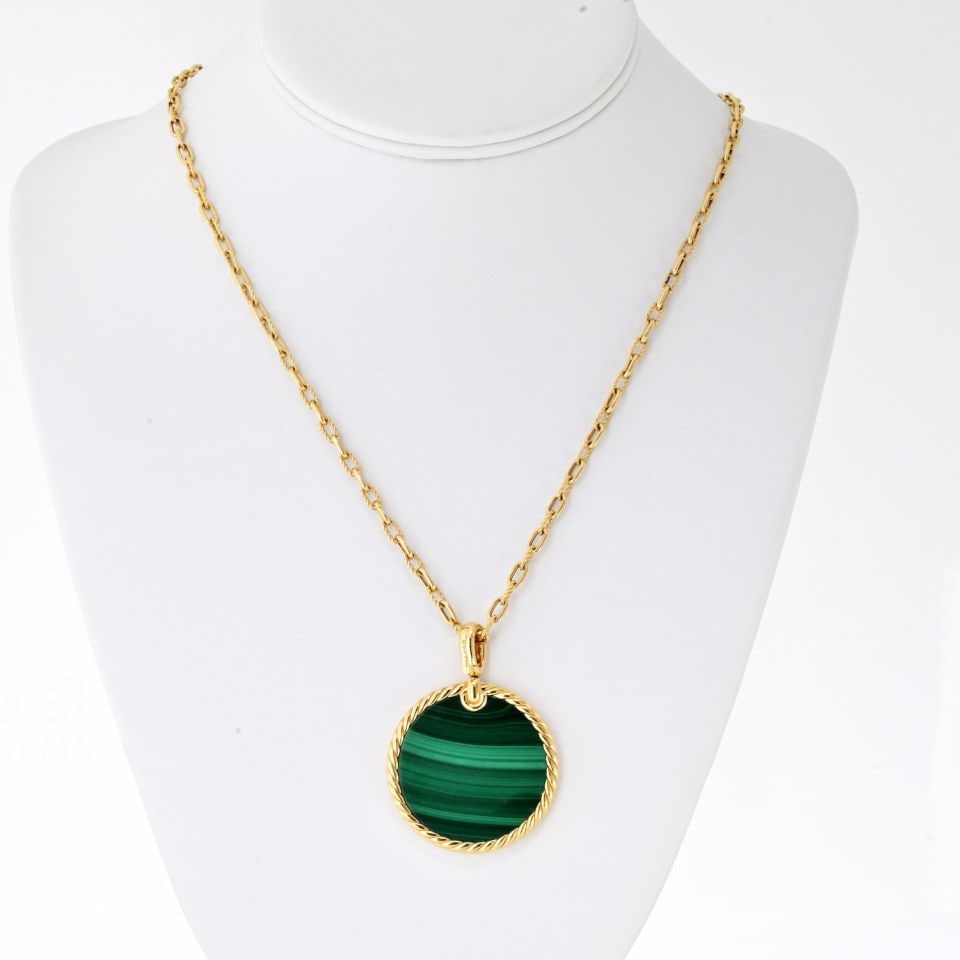 Malachite Disc Pendant Necklace in 18K Yellow Gold by David Yurman: Malachite Disc Pendant Necklace in 18K Yellow Gold by David Yurman This exquisite David Yurman necklace features a stunning round disc pendant made of 18K yellow gold, showcasing a beautiful malachite