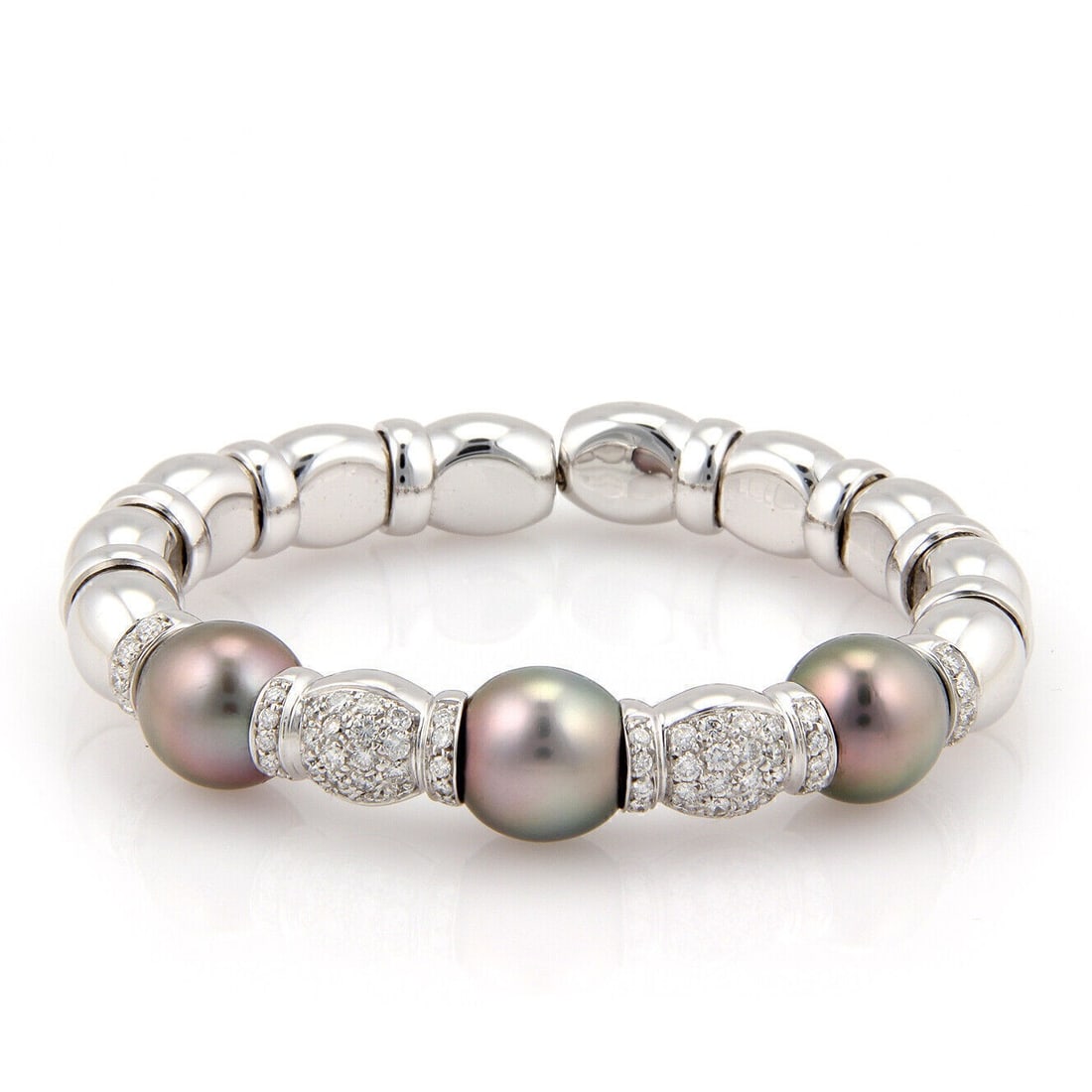 Unbranded 18k White Gold Cuff Bracelet with South Sea Grey Pearls and Diamonds: Unbranded 18k White Gold Cuff Bracelet with South Sea Grey Pearls and Diamonds This vintage/estate cuff bracelet is crafted in solid 18k white gold and features South Sea grey pearls accented with dia