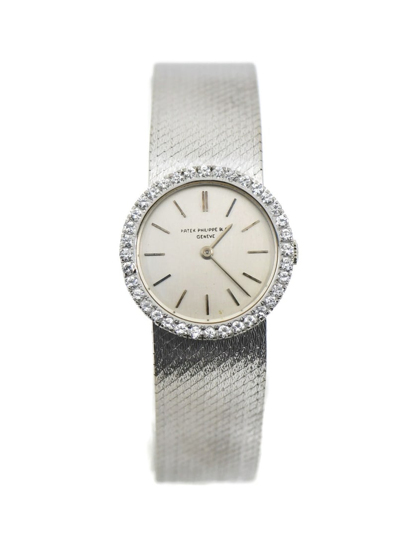 Patek Philippe Vintage Diamond 18K White Gold Wristwatch Ref 3355: Patek Philippe Vintage Diamond 18K White Gold Wristwatch Ref 3355 This exquisite Patek Philippe vintage wristwatch showcases a stunning combination of 18K white gold and diamonds. The watch features a