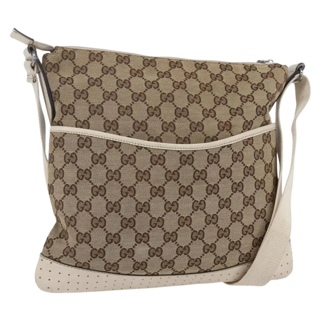 Beige GG Canvas Gucci Zip Messenger Shoulder Bag with Perforated Leather: Beige GG Canvas Gucci Zip Messenger Shoulder Bag with Perforated Leather This is a pre-owned Gucci Zip Messenger Bag crafted from GG canvas with perforated leather accents. Designed for women, it feat