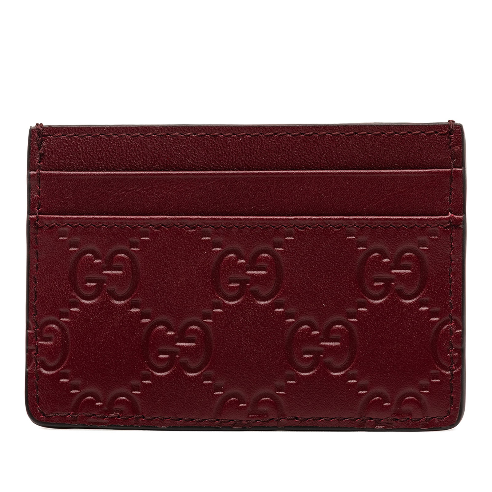 Gucci Guccissima Red Leather Card Holder: Gucci Guccissima Red Leather Card Holder This Guccissima card holder is crafted from embossed red leather and features convenient slip pockets. Made in Italy, it showcases the iconic Guccissima patter