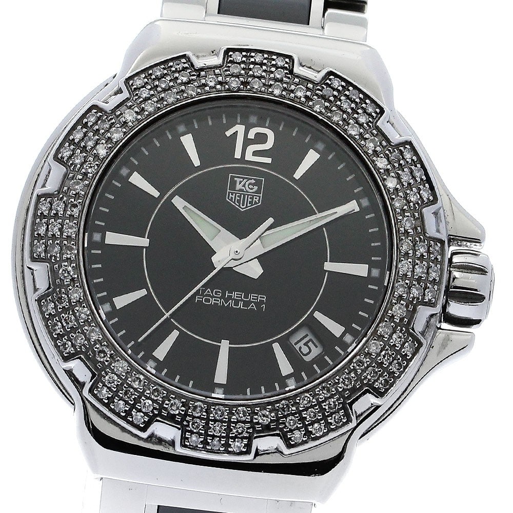 Women's Quartz Wristwatch TAG Heuer Formula 1 WAH1214 Diamond Bezel: Women's Quartz Wristwatch TAG Heuer Formula 1 WAH1214 Diamond Bezel TAG Heuer Formula 1 women's wristwatch with a diamond bezel, quartz movement, and date function. This pre-owned watch features a bla