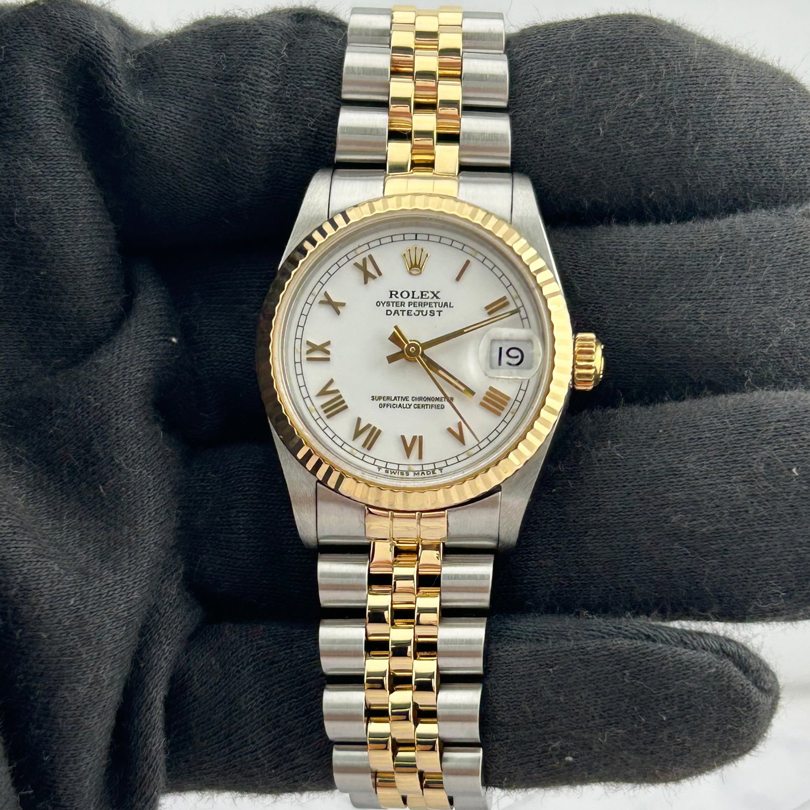 Ladies Rolex Datejust Ref. 68273 White Roman Dial Fluted Bezel: Ladies Rolex Datejust Ref. 68273 White Roman Dial Fluted Bezel Ladies Rolex Datejust watch, reference 68273, featuring a white Roman dial, fluted bezel, and D-Link Jubilee bracelet. The listing identi
