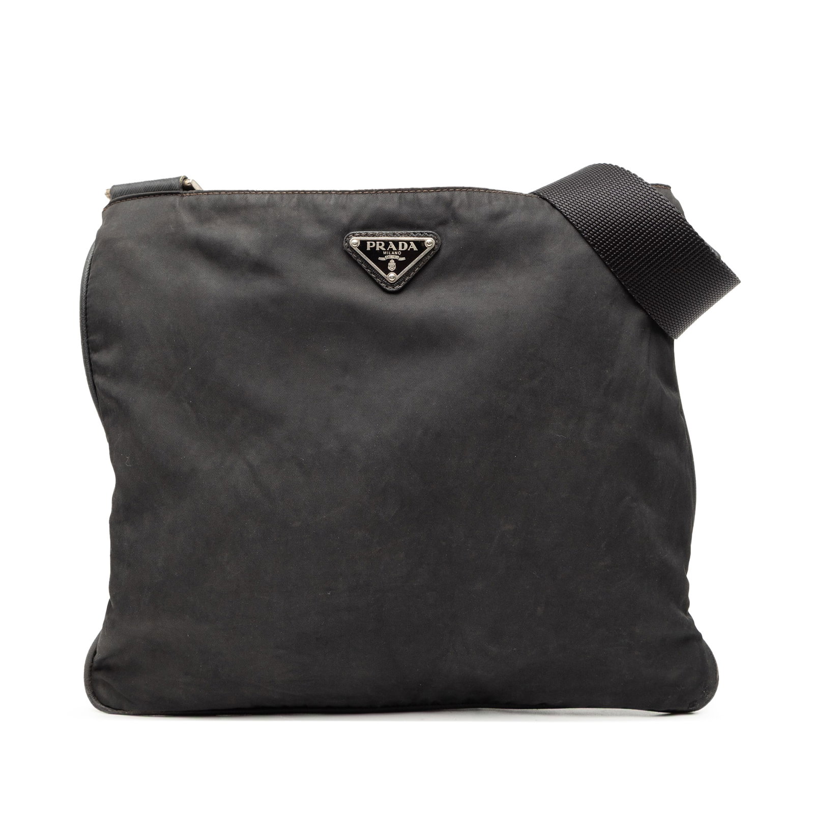 Prada Tessuto Black Nylon Zip-Top Crossbody Bag: Prada Tessuto Black Nylon Zip-Top Crossbody Bag This Prada Tessuto Zip Top Crossbody bag is crafted from black nylon fabric and features an adjustable flat shoulder strap, a secure top zip closure, an