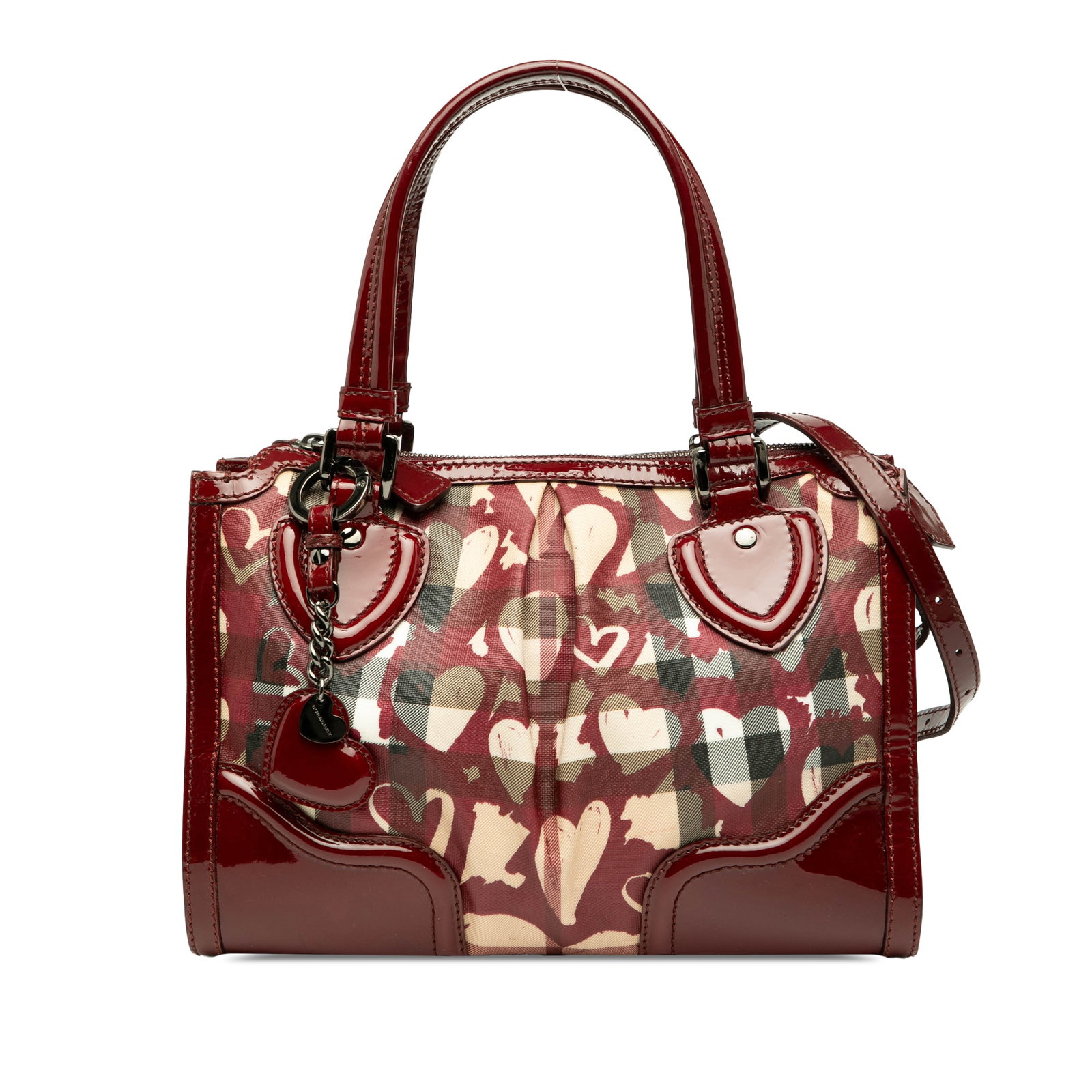Burberry Hearts Pilgrim Satchel Coated Canvas Brown with Patent Trim: Burberry Hearts Pilgrim Satchel Coated Canvas Brown with Patent Trim The Burberry Pilgrim Satchel showcases a stylish printed house check coated canvas body complemented by patent leather trim. It fea