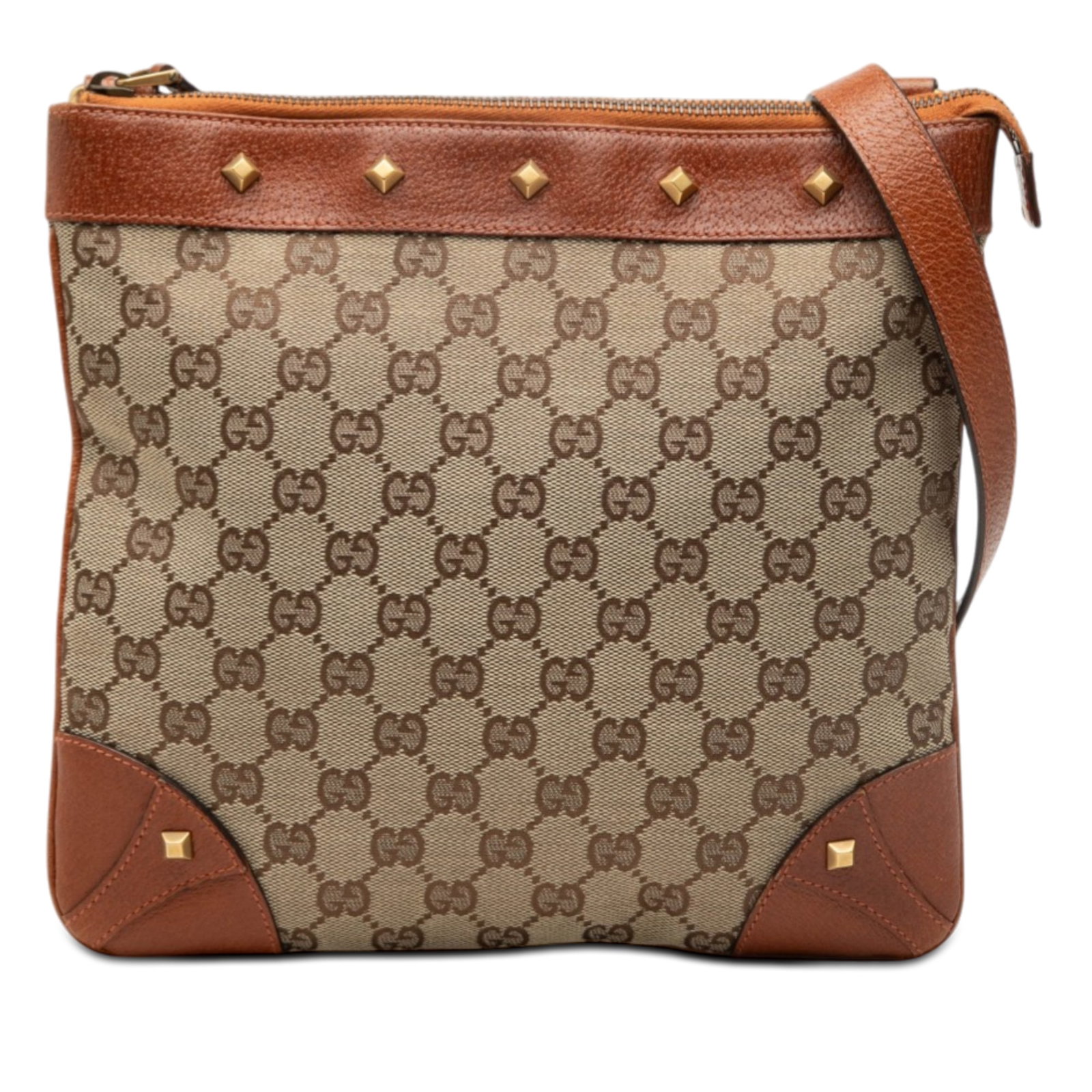 Gucci GG Canvas Nailhead Beige Crossbody Bag with Leather Trim: Gucci GG Canvas Nailhead Beige Crossbody Bag with Leather Trim This Gucci GG Canvas Nailhead Crossbody bag features a beige canvas body with leather trim and an adjustable flat leather strap. It is de