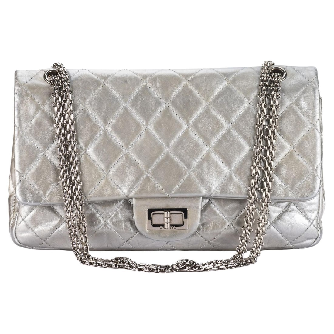 Chanel Reissue Flap Jumbo Metallic Grey Aged Calfskin: Chanel Reissue Flap Jumbo Metallic Grey Aged Calfskin This exquisite Chanel Reissue Flap Jumbo in metallic grey showcases a timeless design crafted from diamond quilted aged and distressed calfskin le