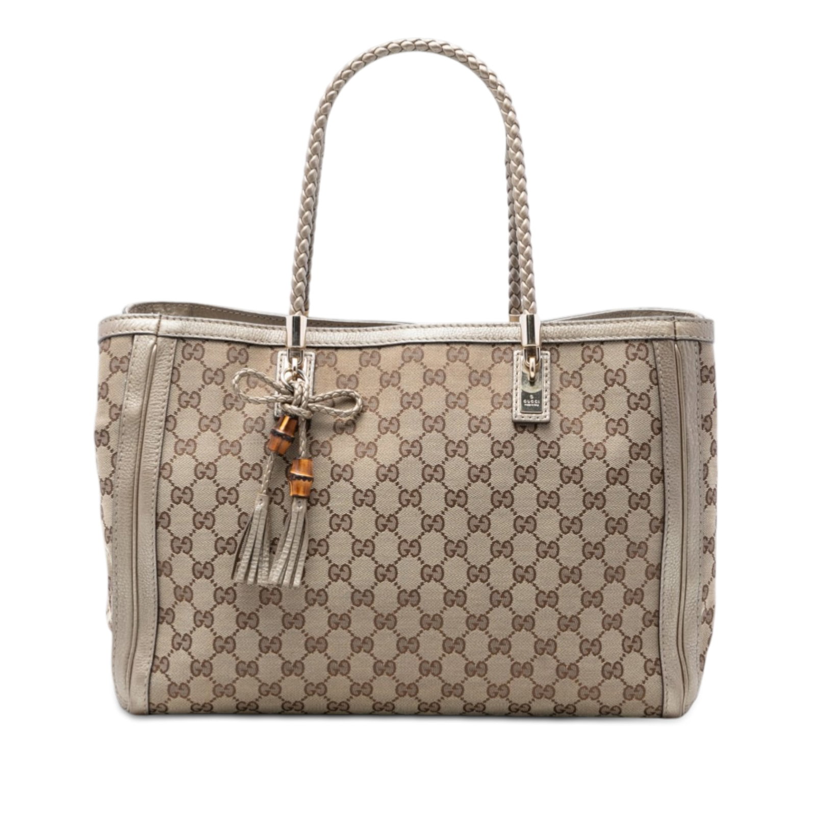 Gucci Bella Tote in GG Canvas with Leather Trim: Gucci Bella Tote in GG Canvas with Leather Trim This Gucci GG Canvas Bella Tote features a beige canvas body with leather trim and braided leather straps adorned with tassel details. The bag has an op