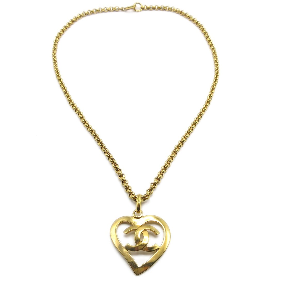 Vintage Chanel CC Heart Pendant Necklace Gold Plated 95P: Vintage Chanel CC Heart Pendant Necklace Gold Plated 95P Vintage Chanel pendant necklace featuring a heart-shaped charm with the CC motif. The necklace is gold-plated and shows reasonable wear, includ