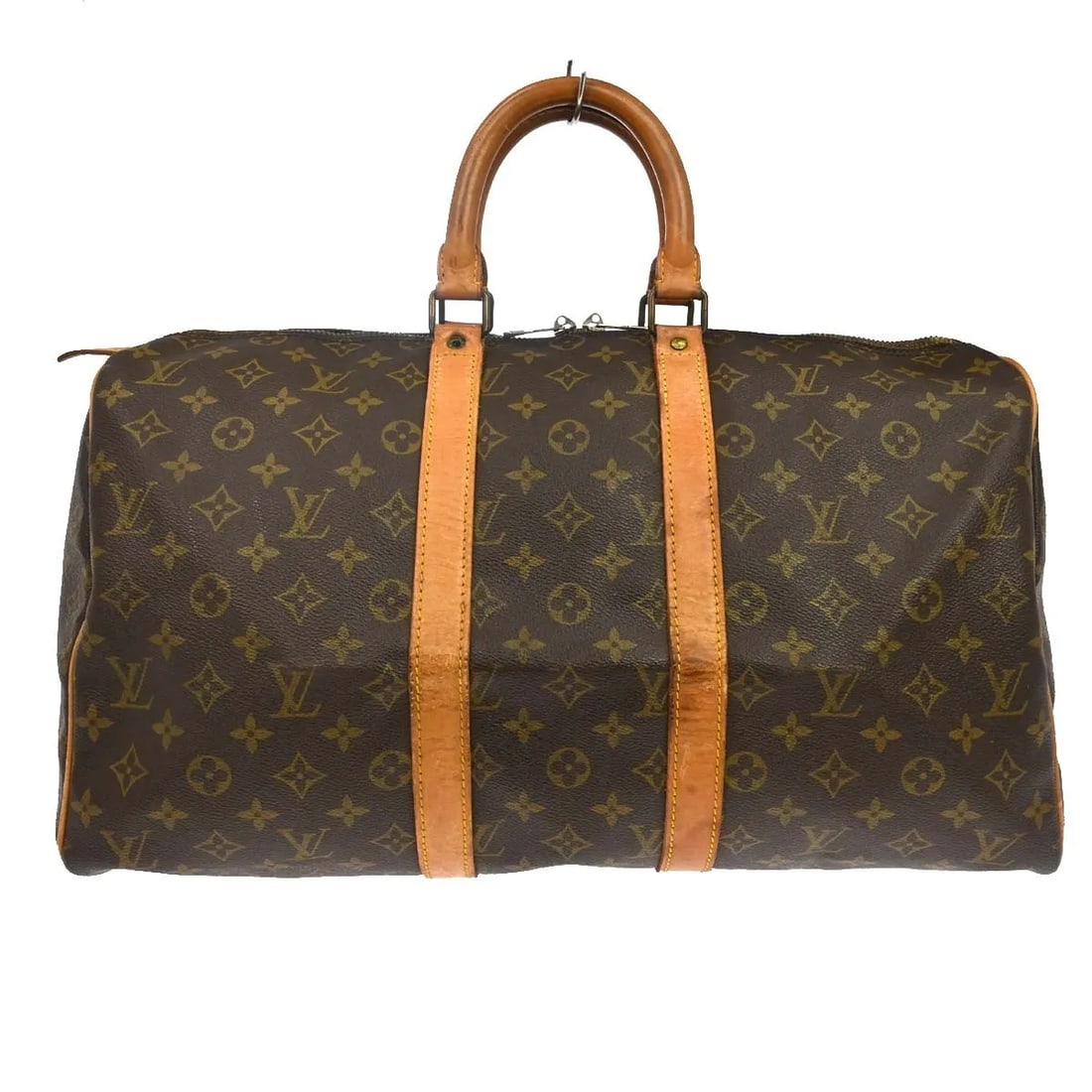 Louis Vuitton Keepall Unisex Brown Monogram Canvas Bag: Louis Vuitton Keepall Unisex Brown Monogram Canvas Bag Louis Vuitton Keepall in brown monogram canvas. This unisex bag is made in France and is presented in fair condition with visible wear. The leath