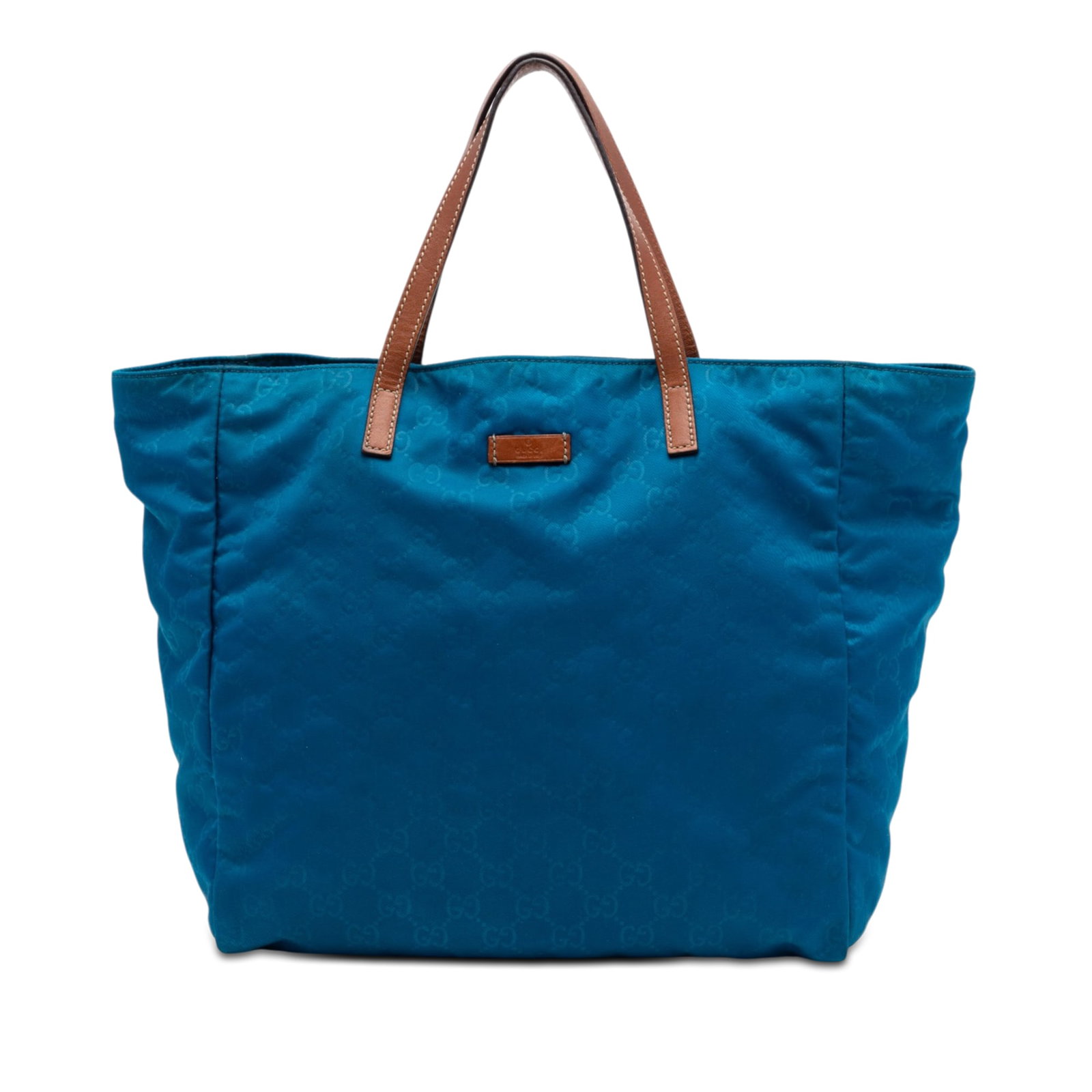 Gucci GG Nylon Tote Bag Blue Leather Strap Open Top: Gucci GG Nylon Tote Bag Blue Leather Strap Open Top Gucci GG Nylon Tote in blue, made in Italy. This tote bag features a nylon body, flat leather straps, an open top, and interior zip and slip pockets
