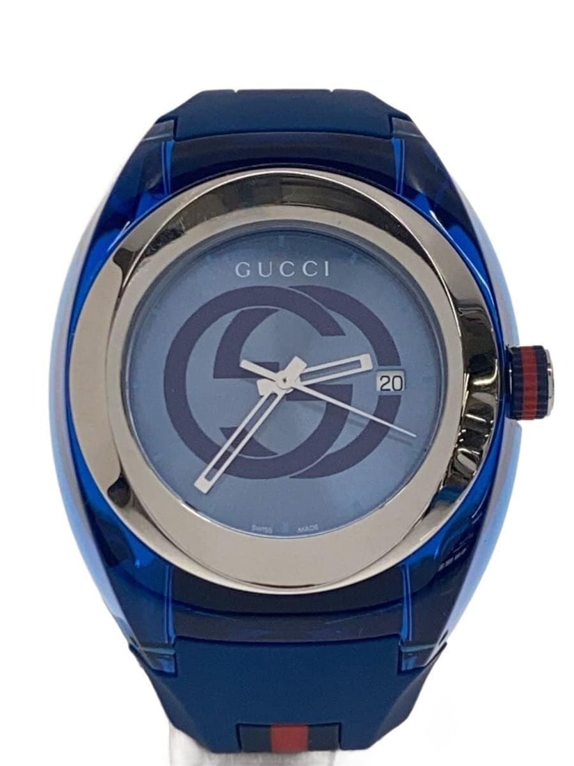 Gucci Synk Navy Stainless Steel Men's Wristwatch: Gucci Synk Navy Stainless Steel Men's Wristwatch This is a pre-owned men's GUCCI SYNK 137.1 wristwatch, crafted in stainless steel with a navy color scheme. The watch is in slightly used condition and