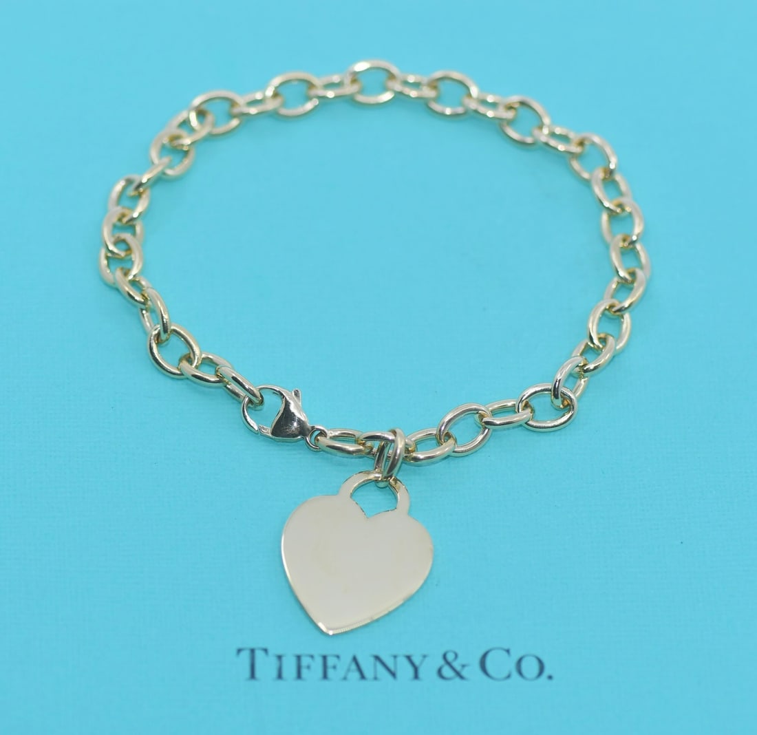 18K Yellow Gold Chain Bracelet by Tiffany & Co with Box and Pouch: 18K Yellow Gold Chain Bracelet by Tiffany & Co with Box and Pouch This Tiffany & Co. bracelet is crafted from 18K yellow gold and features a classic chain style. The bracelet measures 7 inches in leng