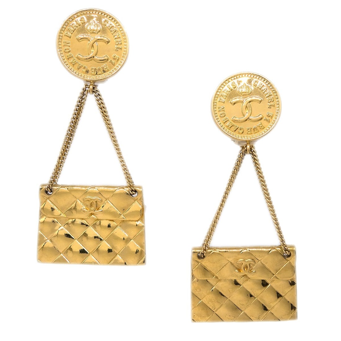 Chanel Clip On Gold Plated Dangle Earrings Bag Motif: Chanel Clip On Gold Plated Dangle Earrings Bag Motif Pair of Chanel clip-on dangle earrings in gold-plated metal. These square button-style earrings are made in France and show scratches consistent wi