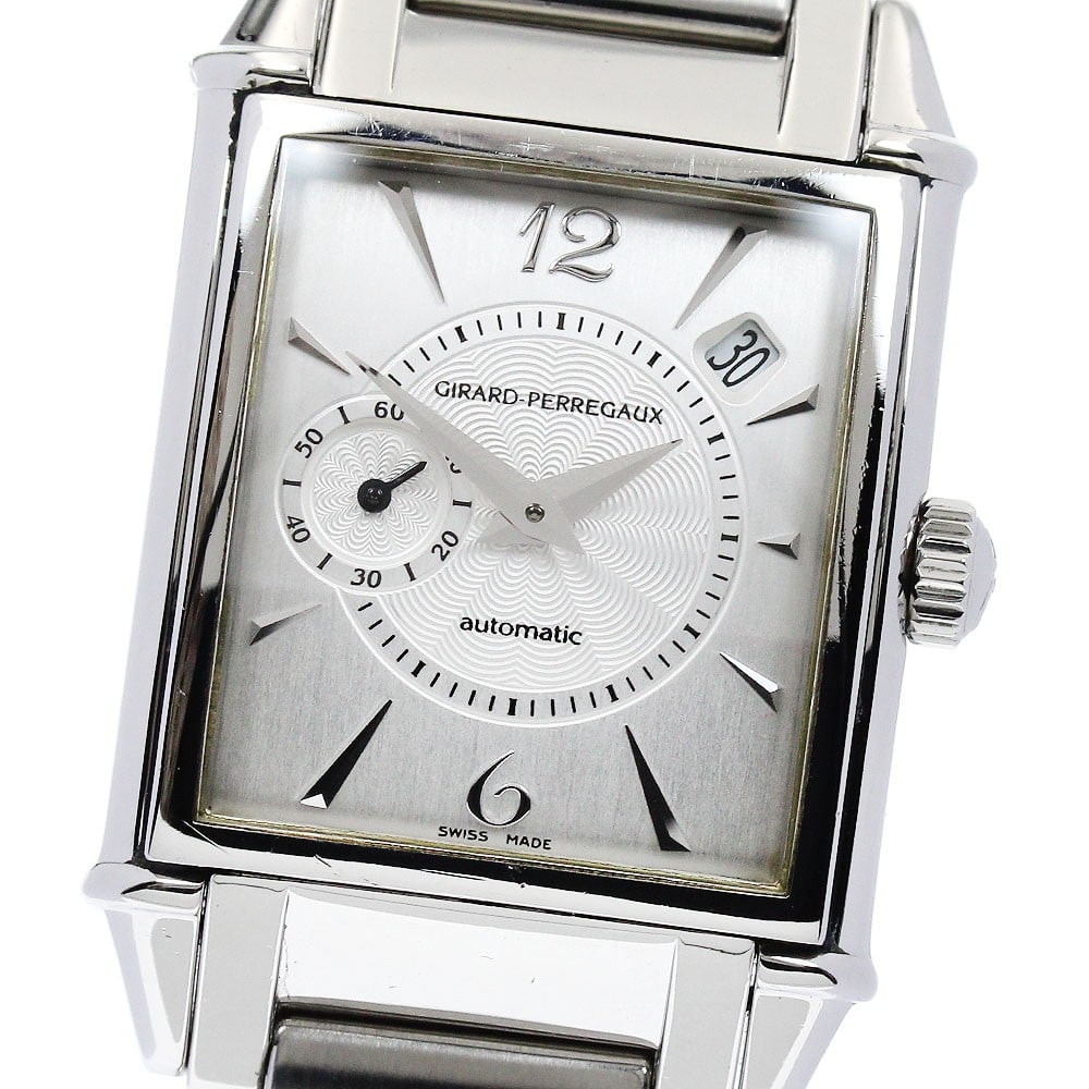 Vintage 1945 Girard Perregaux automatic stainless steel men's watch: Vintage 1945 Girard Perregaux automatic stainless steel men's watch This Girard Perregaux Vintage 1945 Date men's wristwatch features a stainless steel case and band with a silver dial. The watch is e