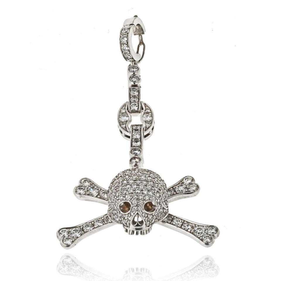 18K White Gold Diamond Skull Charm Pendant 3.81 Cts 2.6 in: 18K White Gold Diamond Skull Charm Pendant 3.81 Cts 2.6 in This stunning 18K White Gold Diamond Skull Charm Pendant showcases a unique and intricate design. Crafted from high-quality 18K white gold, i