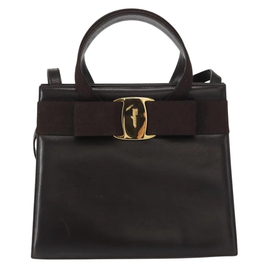 Vara Bow Convertible Brown Leather Tote by Salvatore Ferragamo: Vara Bow Convertible Brown Leather Tote by Salvatore Ferragamo This Salvatore Ferragamo Convertible Vara Bow Tote is crafted from brown leather and designed for women. It features both handles and a s