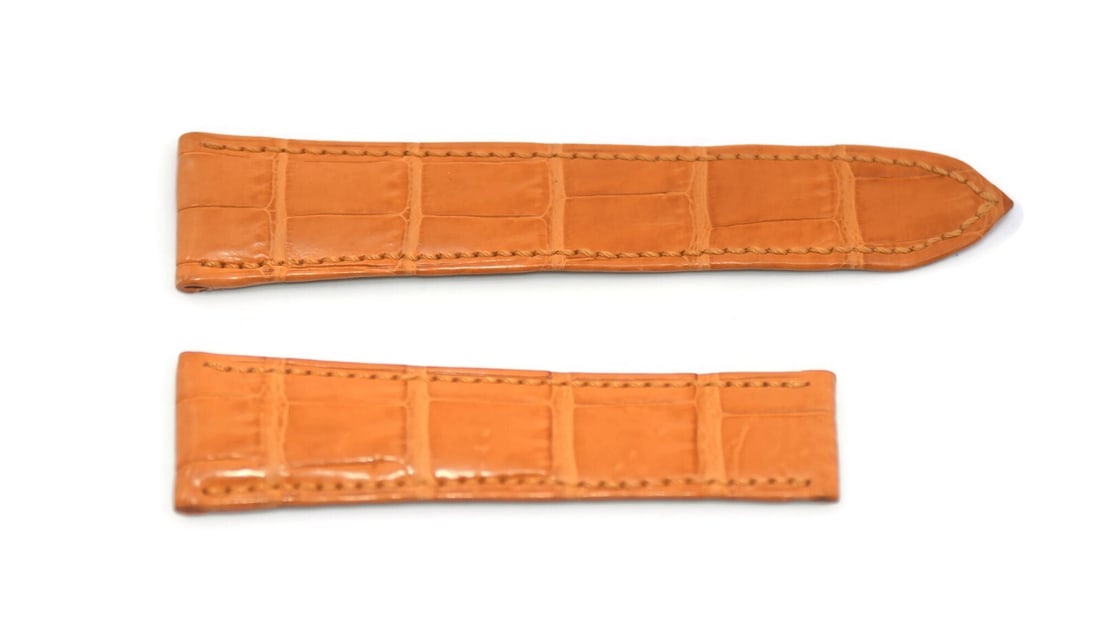 Bedat & Co Authentic Orange Leather Wristwatch Strap 19mm: Bedat & Co Authentic Orange Leather Wristwatch Strap 19mm This Bedat & Co. orange leather strap is a stylish accessory designed for wristwatches. With a width of 19mm and a tapering down to 16mm, this