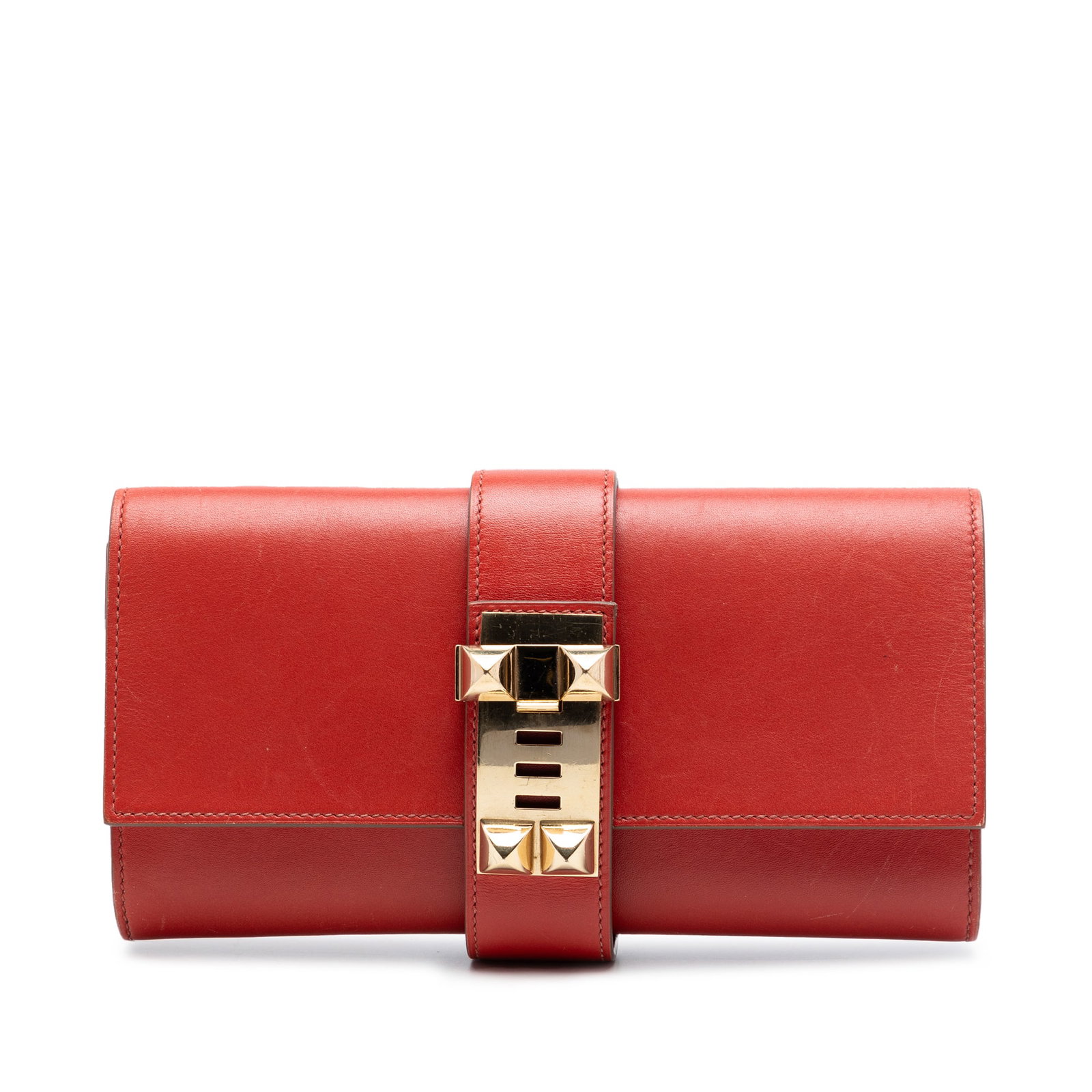 Hermes Medor 23 clutch in Rouge Tomate Tadelakt leather: Hermes Medor 23 clutch in Rouge Tomate Tadelakt leather The Medor 23 clutch bag features a Tadelakt leather body in Rouge Tomate, a front flap with metal closure, and an interior slip pocket. It is ma