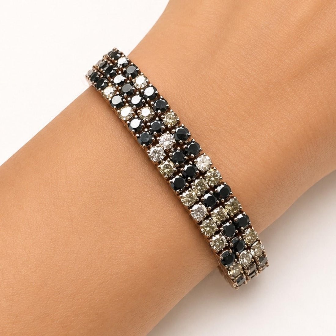 18K Rose Gold Bracelet with White Champagne Black Diamonds: 18K Rose Gold Bracelet with White Champagne Black Diamonds This elegant bracelet is crafted from 18K rose gold and features an exquisite combination of white, champagne, and black diamonds. The bracel
